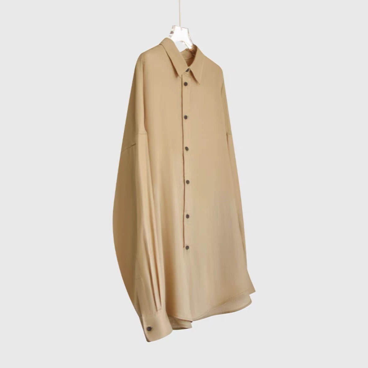 Eco-friendly 100% linen long sleeve top featuring curved hem and French seams