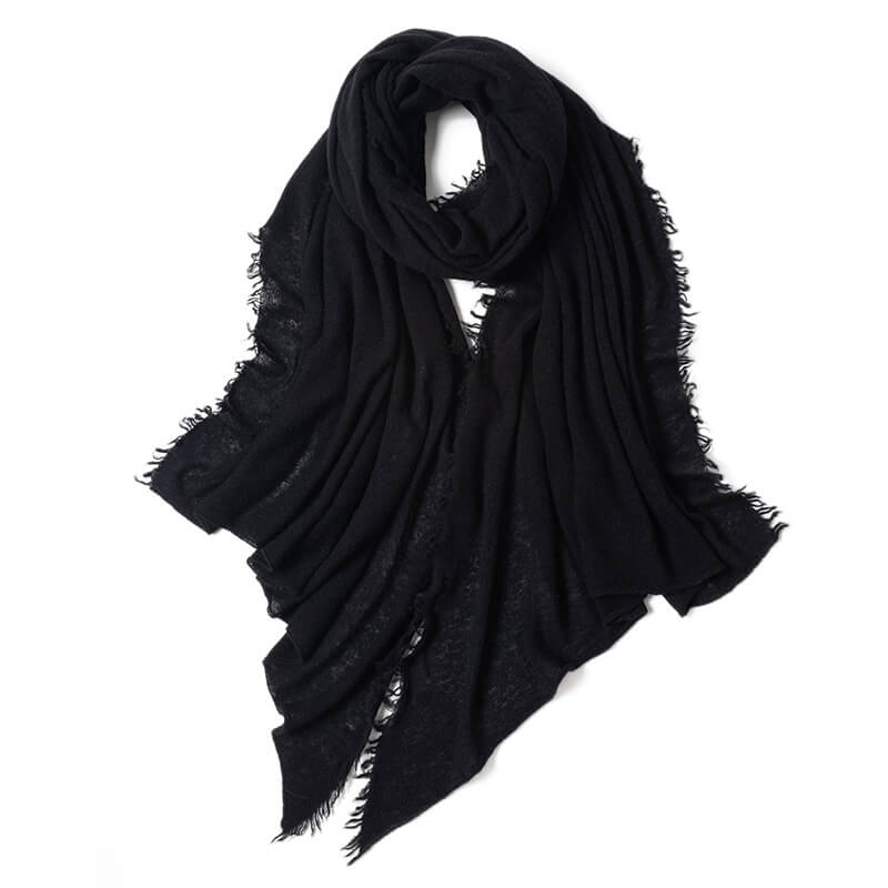 Raw-edge cashmere scarf in black styled with leather jacket for urban look