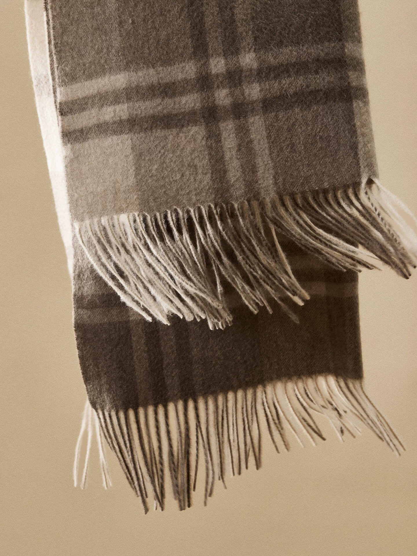 Natural undyed beige cashmere shawl with soft finish,Classic camel plaid cashmere scarf on neutral background