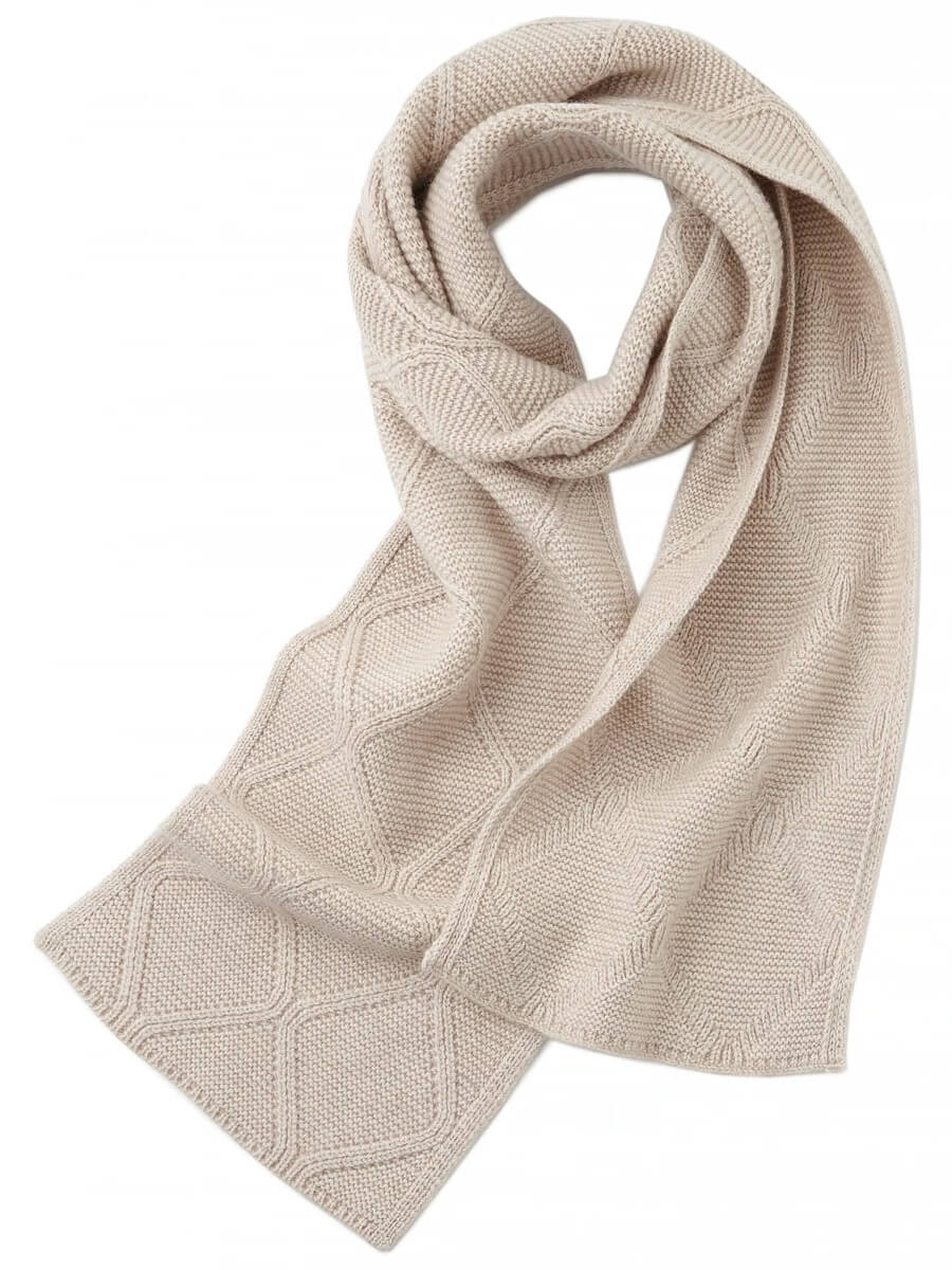 Beige knitted 100% cashmere scarf on a white background