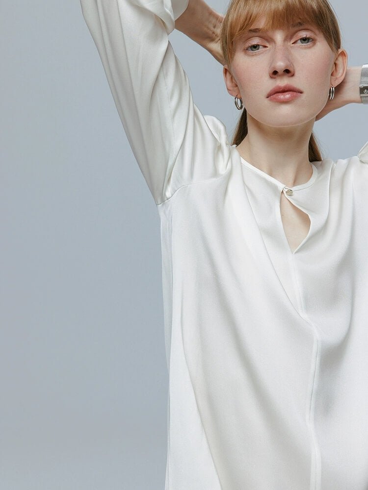 Woman wearing a white 100% silk blouse