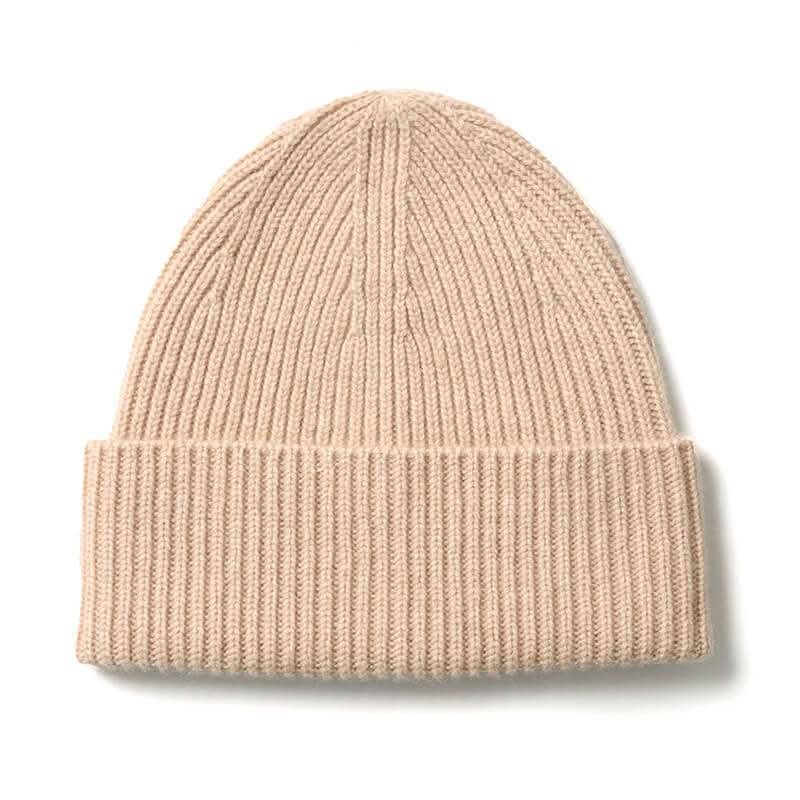 Close-up texture of 100% cashmere cream beanie and ribbed cuff detail