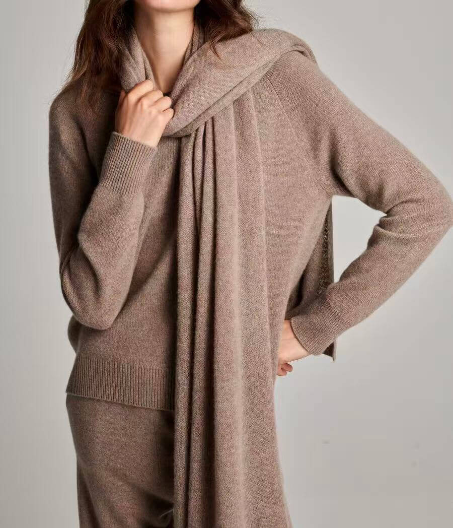 Lightweight 100% cashmere scarf in ivory and neutral tones showing natural fiber softness