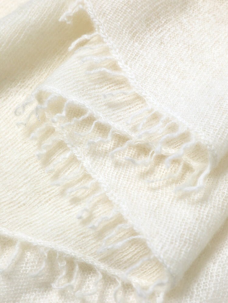 Thin cashmere travel scarf with hand-twisted tassels”