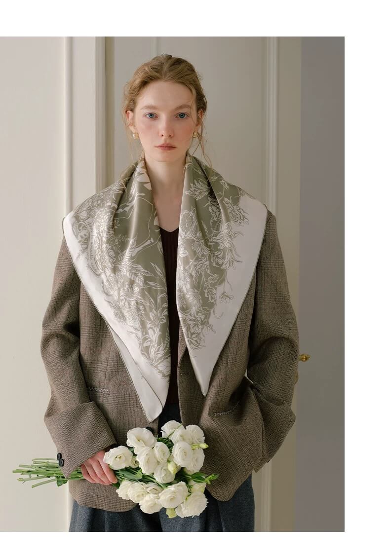 Luxury silk horse scarf flatlay showcasing artistic forest and galloping horse design