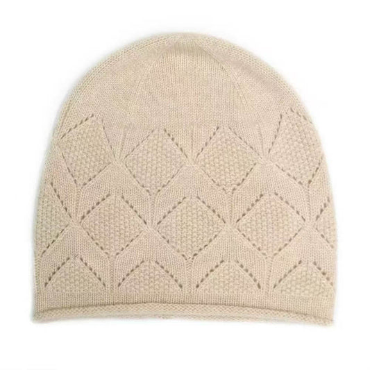 A light beige knit pure cashmere beanie hat featuring a textured geometric diamond pattern