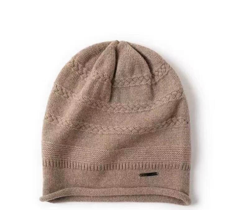 A light brown knit pure cashmere beanie hat with horizontal textured bands and a ribbed cuff