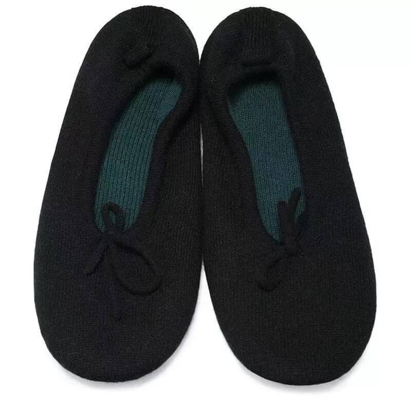 A pair of black knit slip-on pure cashmere women's slippers with a dark teal ribbed inner lining