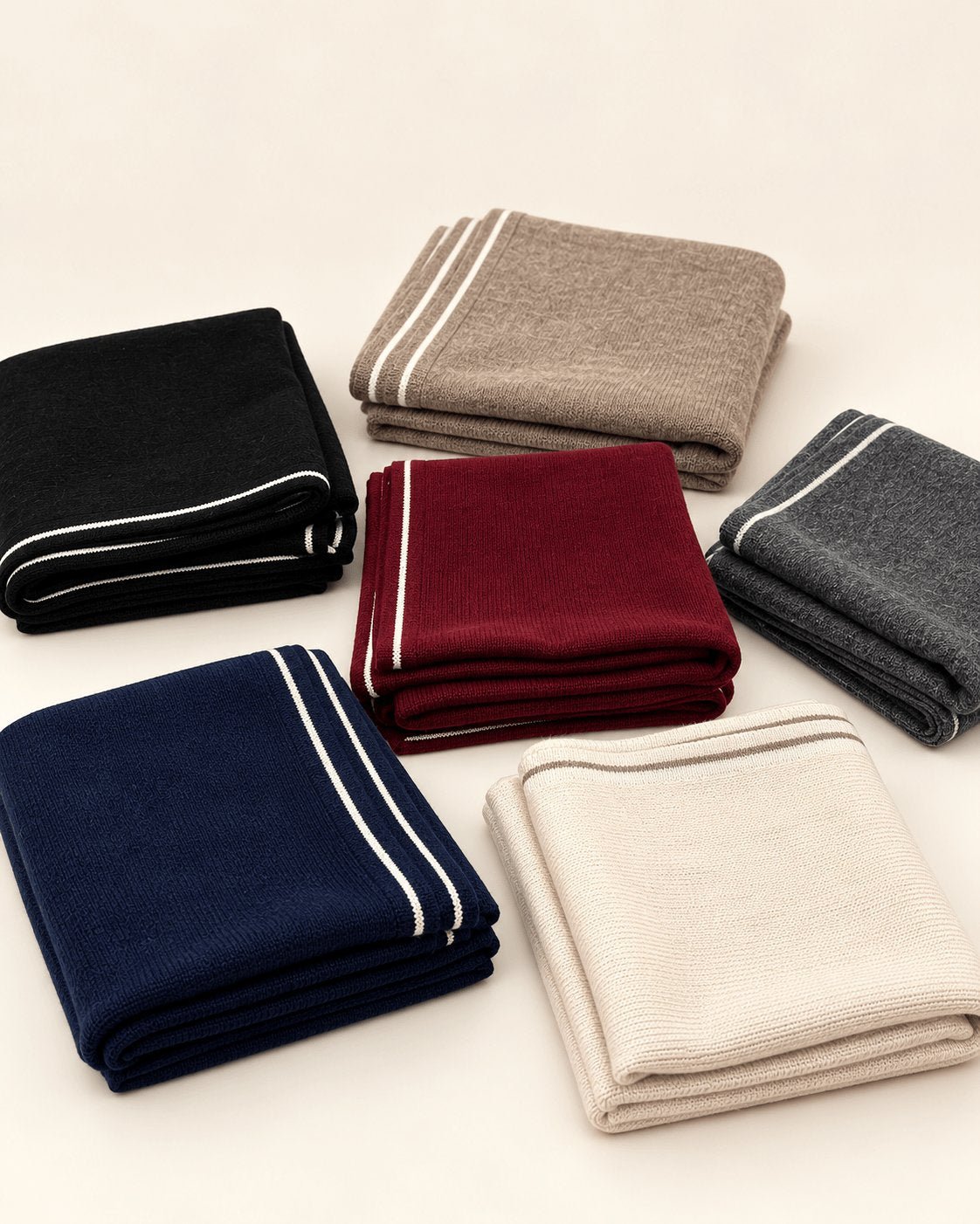 Camel brown cashmere square scarf displayed flat, highlighting its classic square silhouette and ivory border trim.