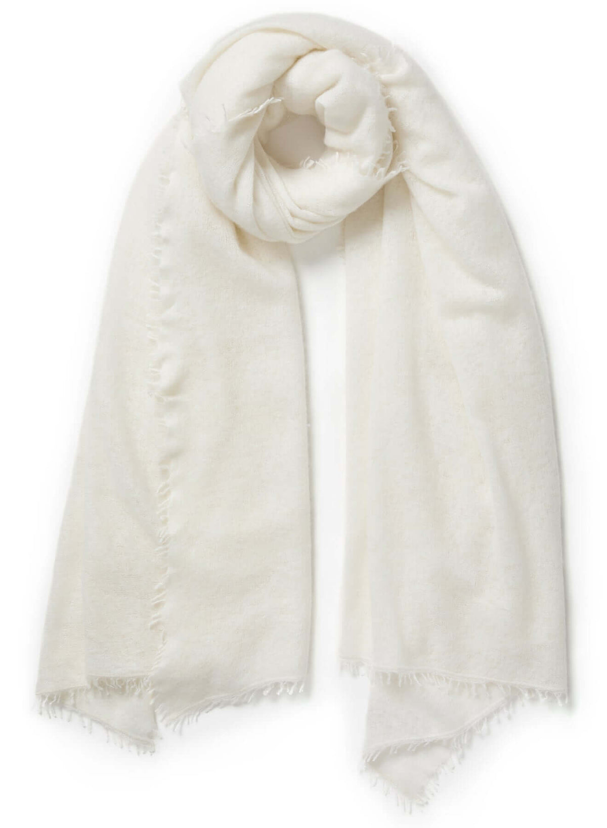 Close-up of a natural white lightweight cashmere scarf, highlighting its soft, airy texture and delicate hand-twisted fringe.