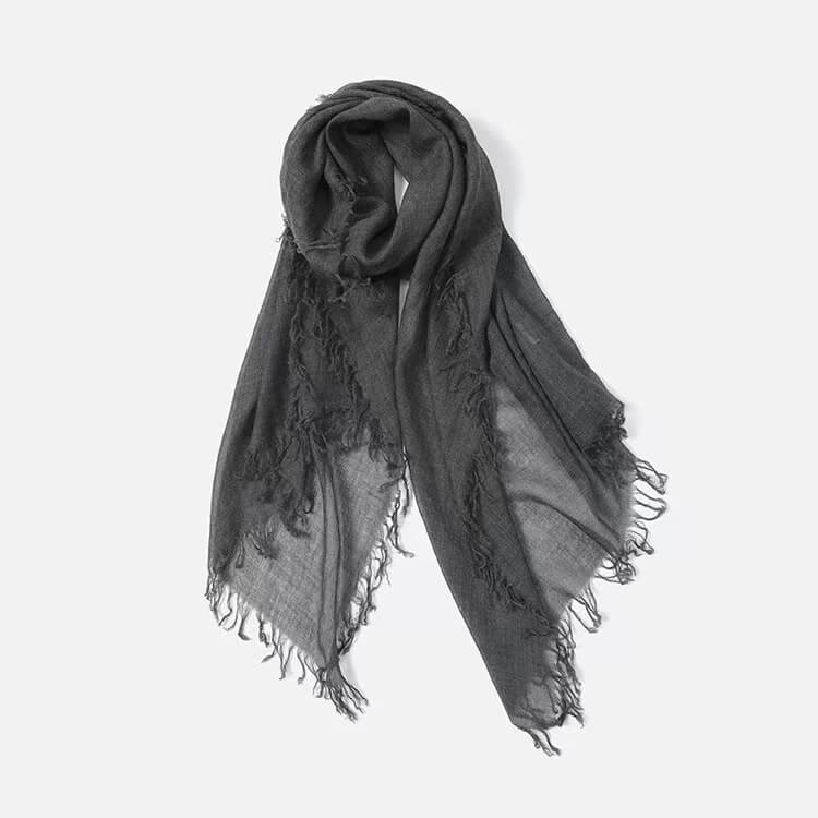 Elegant pure cashmere scarf draped as a light shawl