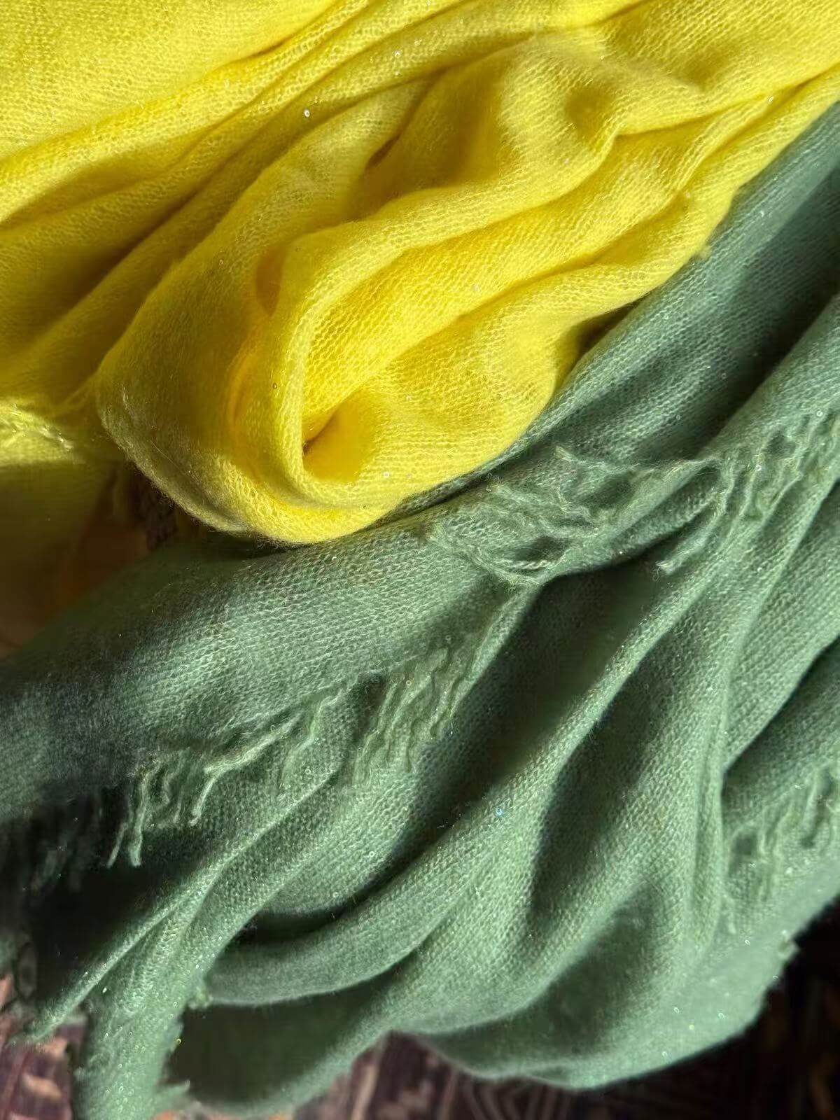 Fine Inner Mongolian cashmere scarf with subtle sequin embellishments, soft draping fabric and hand-twisted fringe edges.