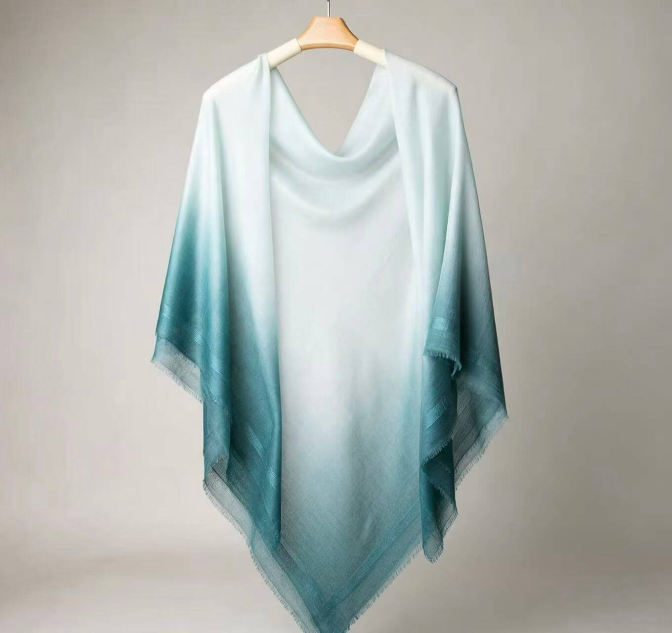 Lightweight cashmere wrap in ivory and pine green for summer travel