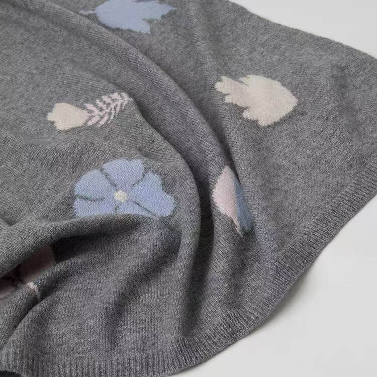 Designer cashmere scarf with pink petals and blue leaves