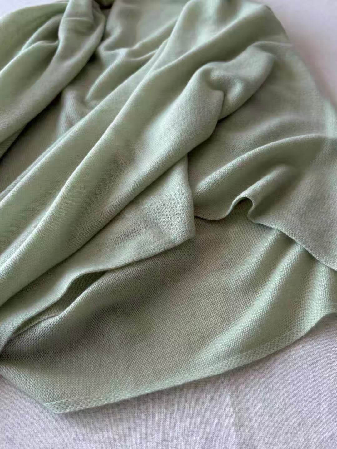 Oversized cashmere square scarf folded as a triangle shawl