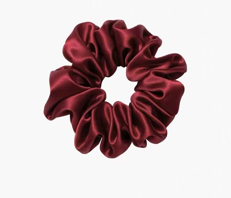 Luxury silk beauty gift set featuring three silk scrunchies and one silk eye mask

