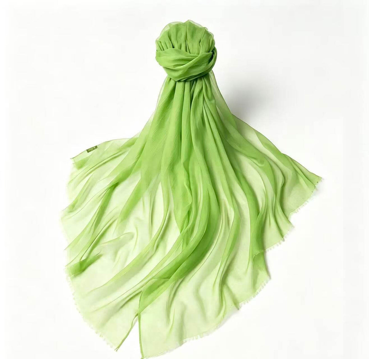 Luxury women's 100% cashmere lightweight scarf in fresh leaf green with a soft gradient to pale green
