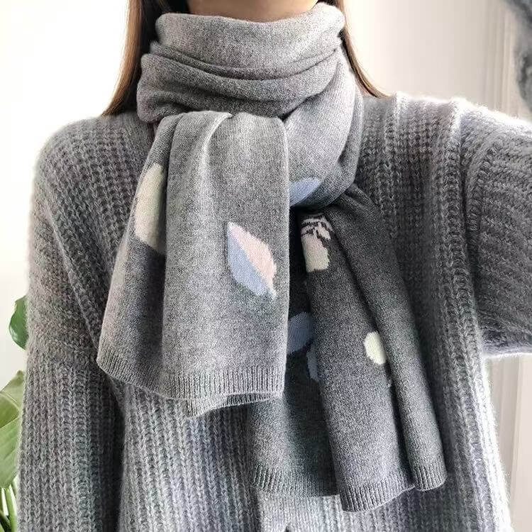 Premium knitted cashmere wrap with elegant botanical motif