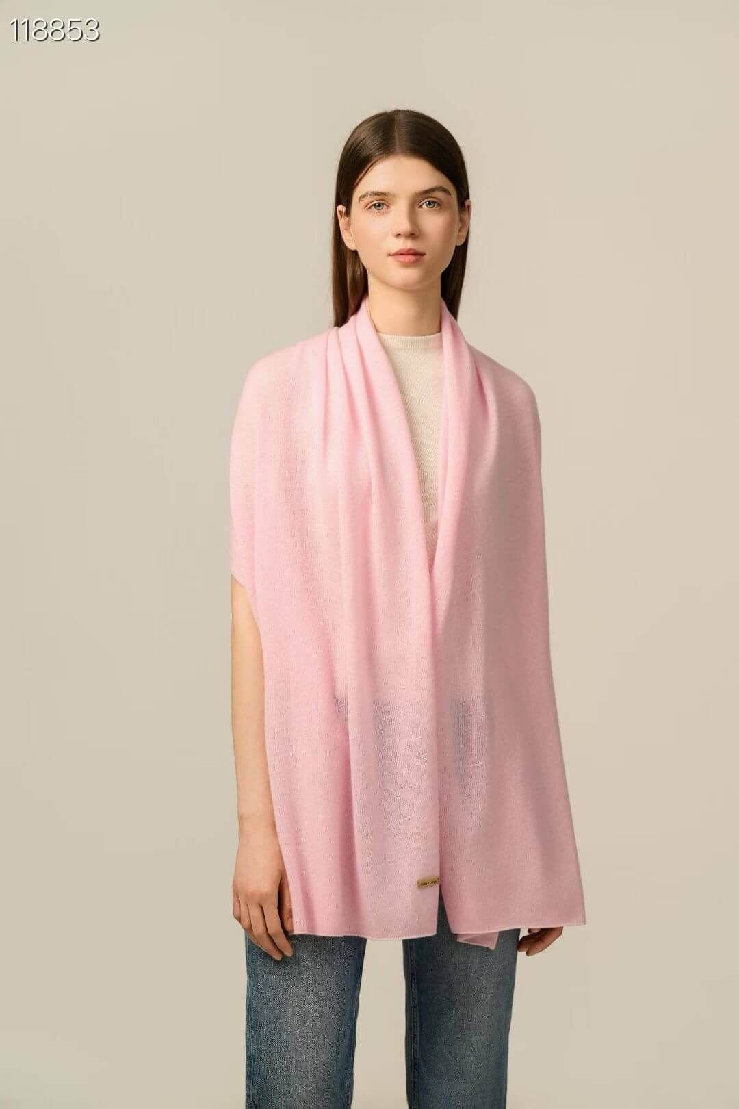 Pure cashmere shawl draped over shoulders, a refined solid color wrap for women