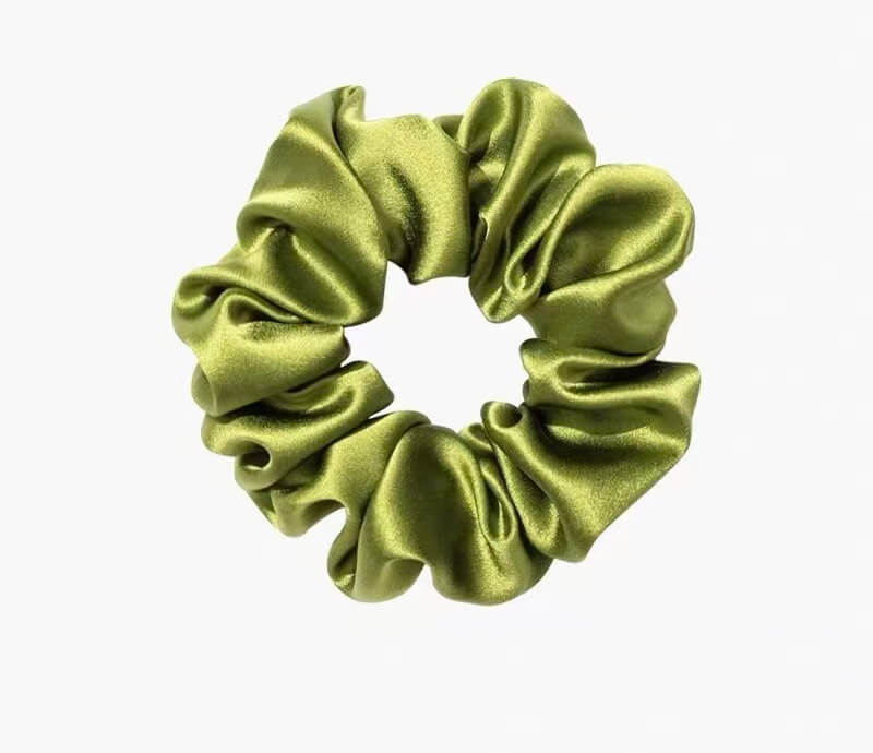 Pure mulberry silk scrunchies in assorted colors with matching navy silk eye mask