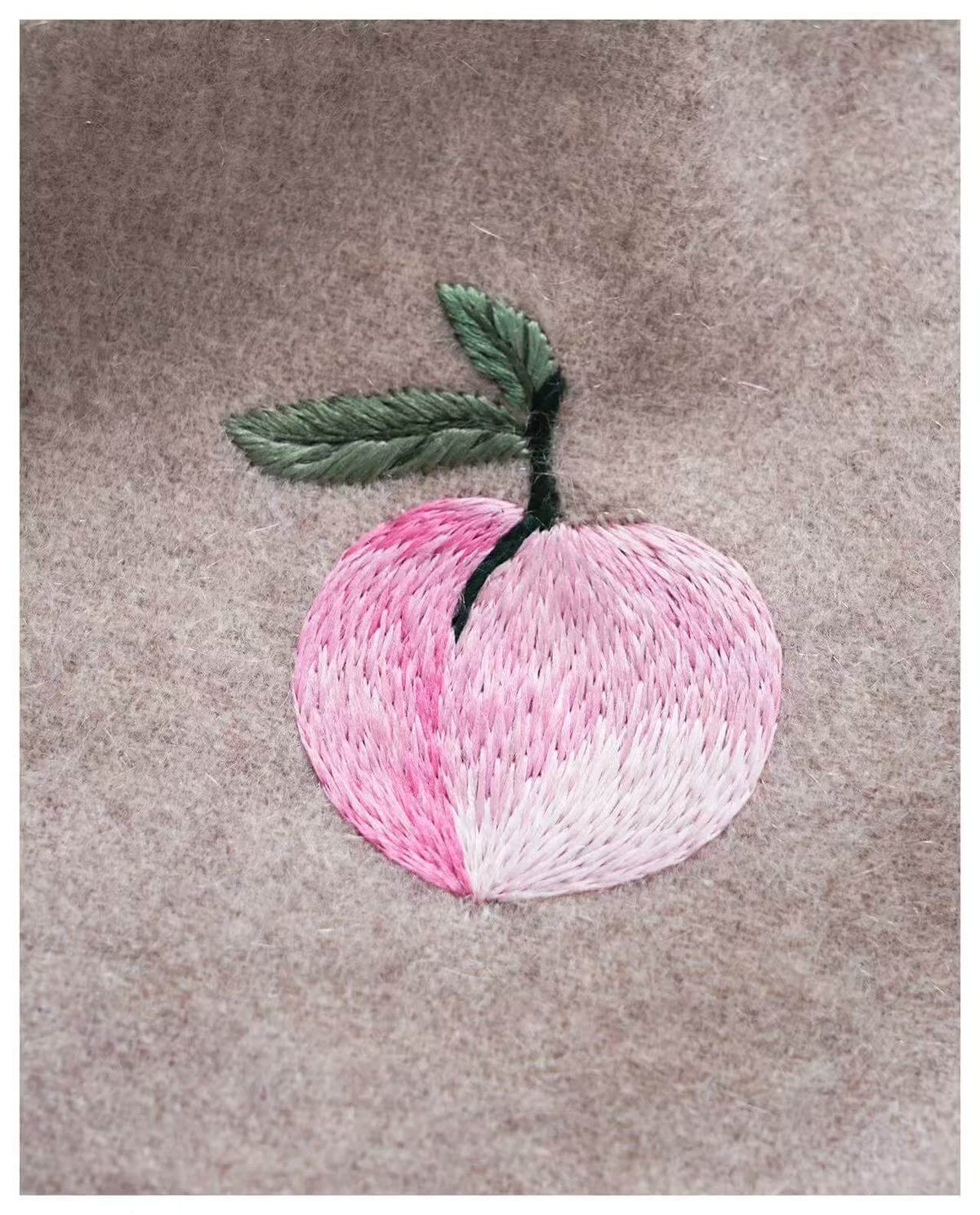 Soft 100% cashmere scarf in oatmeal with hand-embroidered pink peach