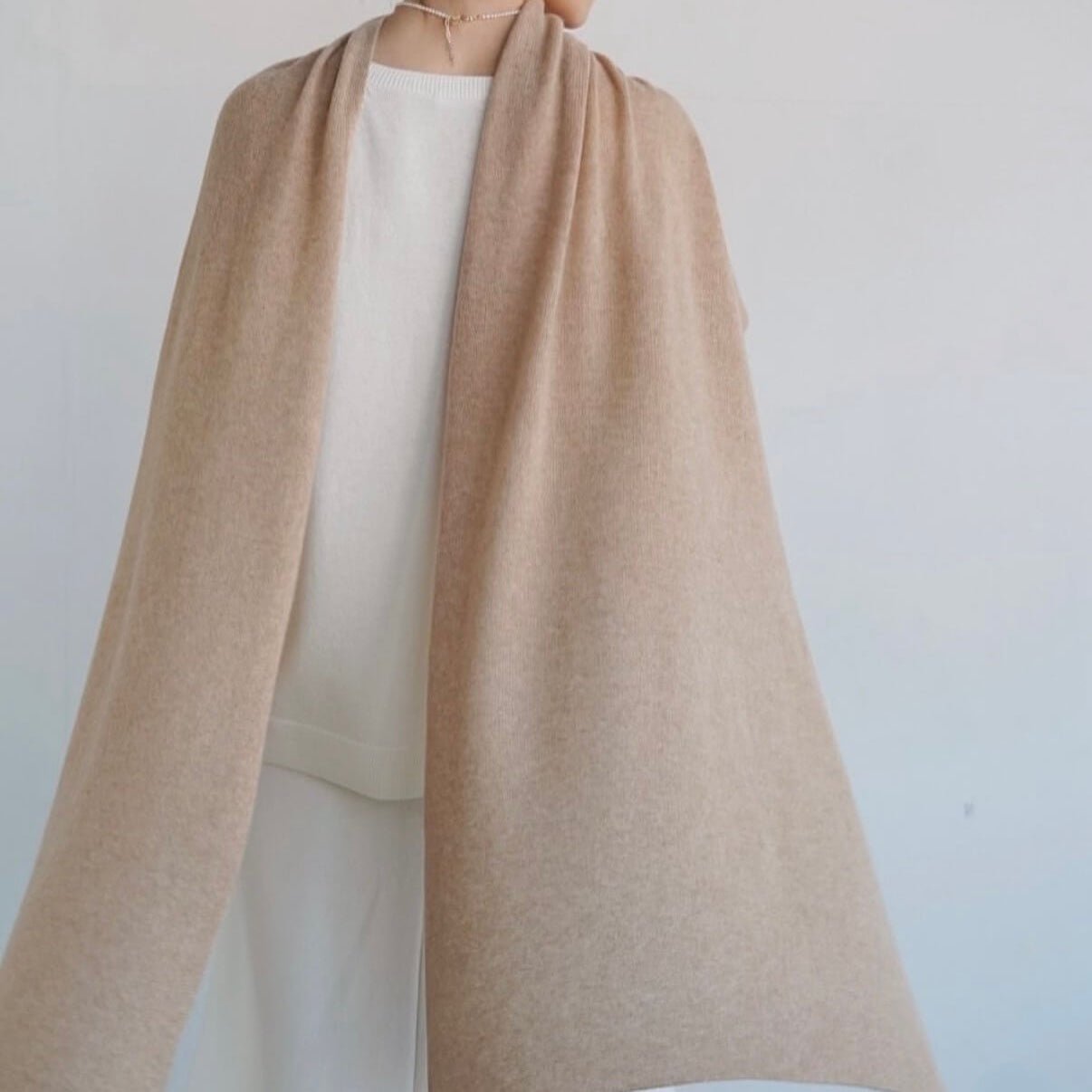Luxury cashmere wrap scarf worn over evening dress for wedding