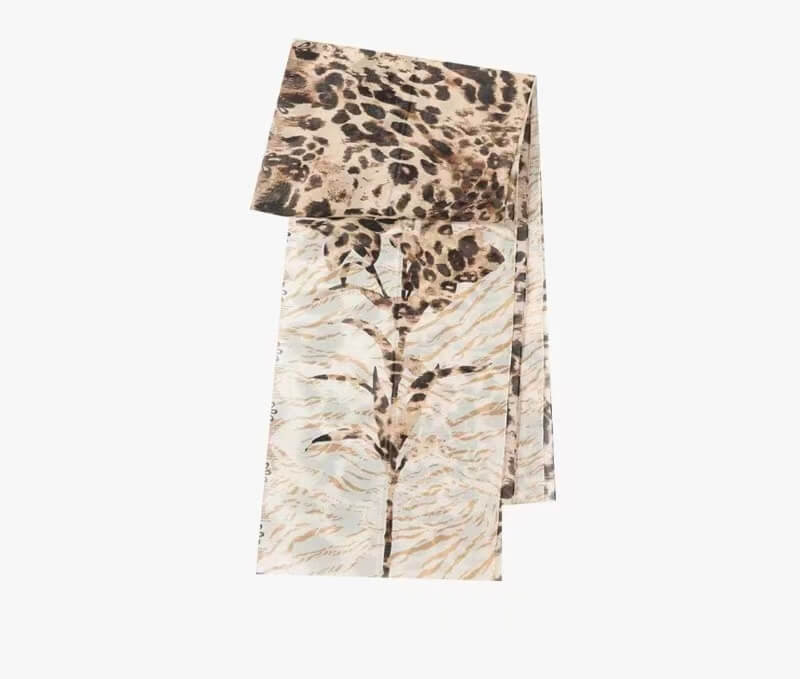 Soft flowing leopard print silk scarf with elegant drape movement