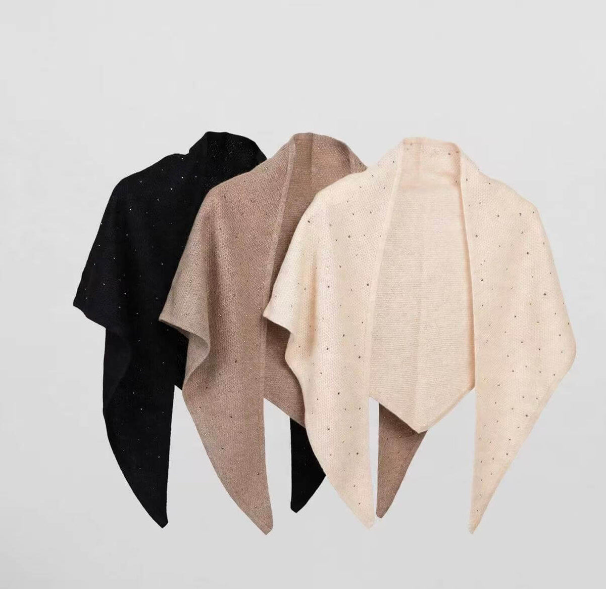 Three 100% cashmere triangle scarves in beige, camel and black, featuring delicate scattered rhinestone embellishments.
