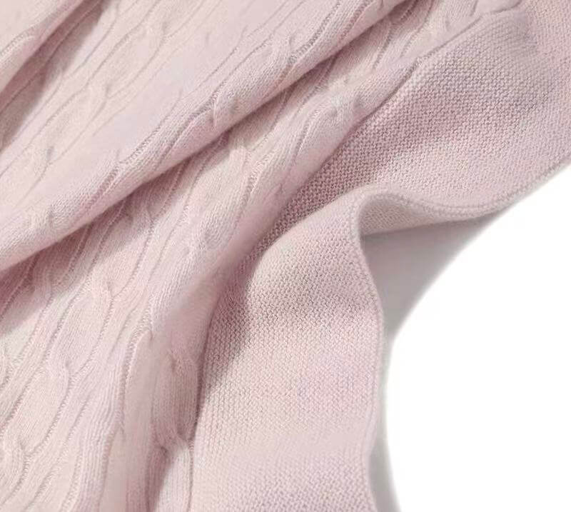 Toddler sleeping with 350g pure cashmere cable knit blanket in baby pink