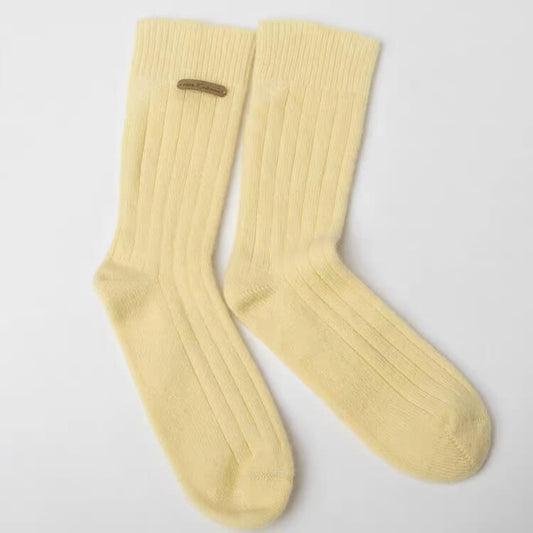 A pair of pale yellow ribbed crew socks Women’s 100% Cashmere Bed Socks