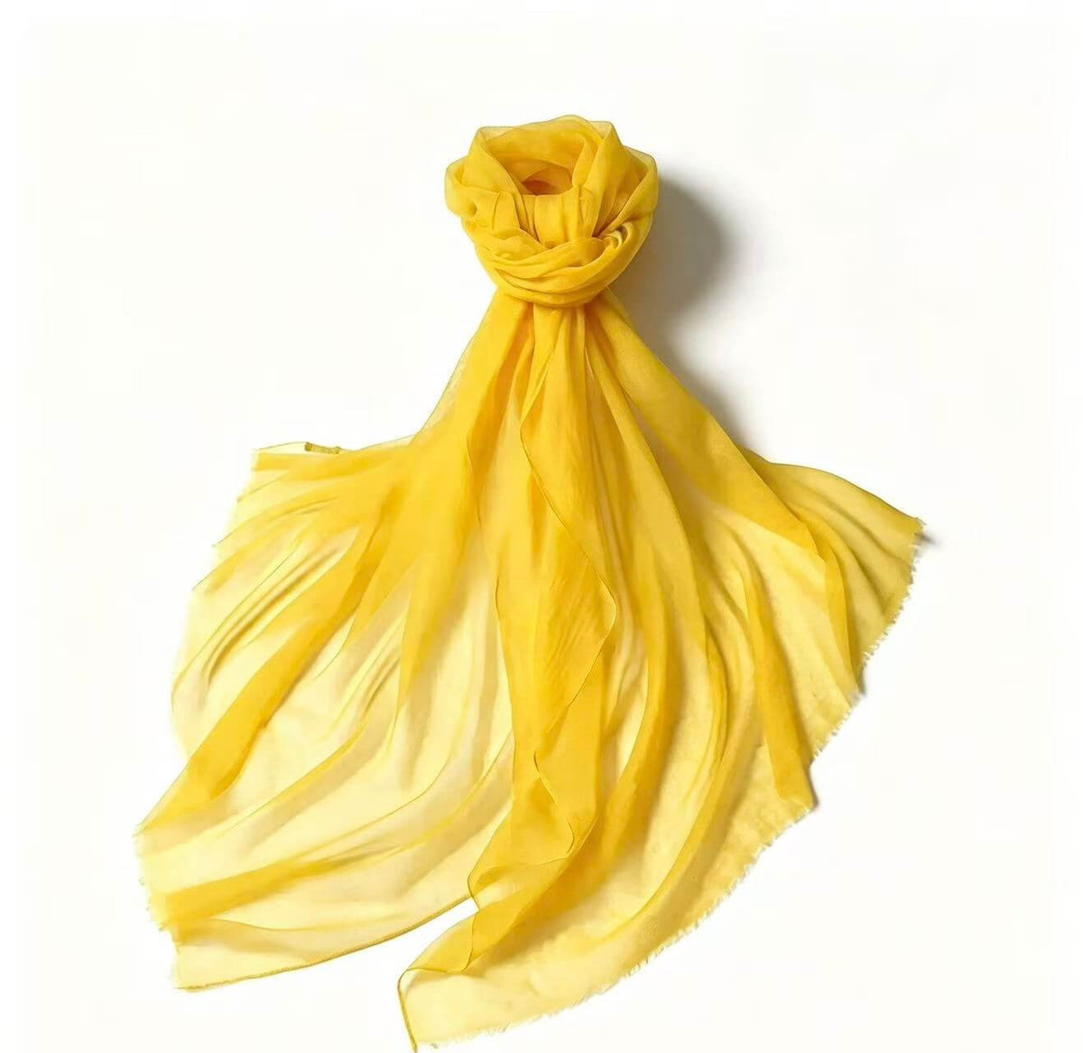 Women's featherweight 100% cashmere scarf in vibrant yellow with a soft ombre effect and delicate fringed edges