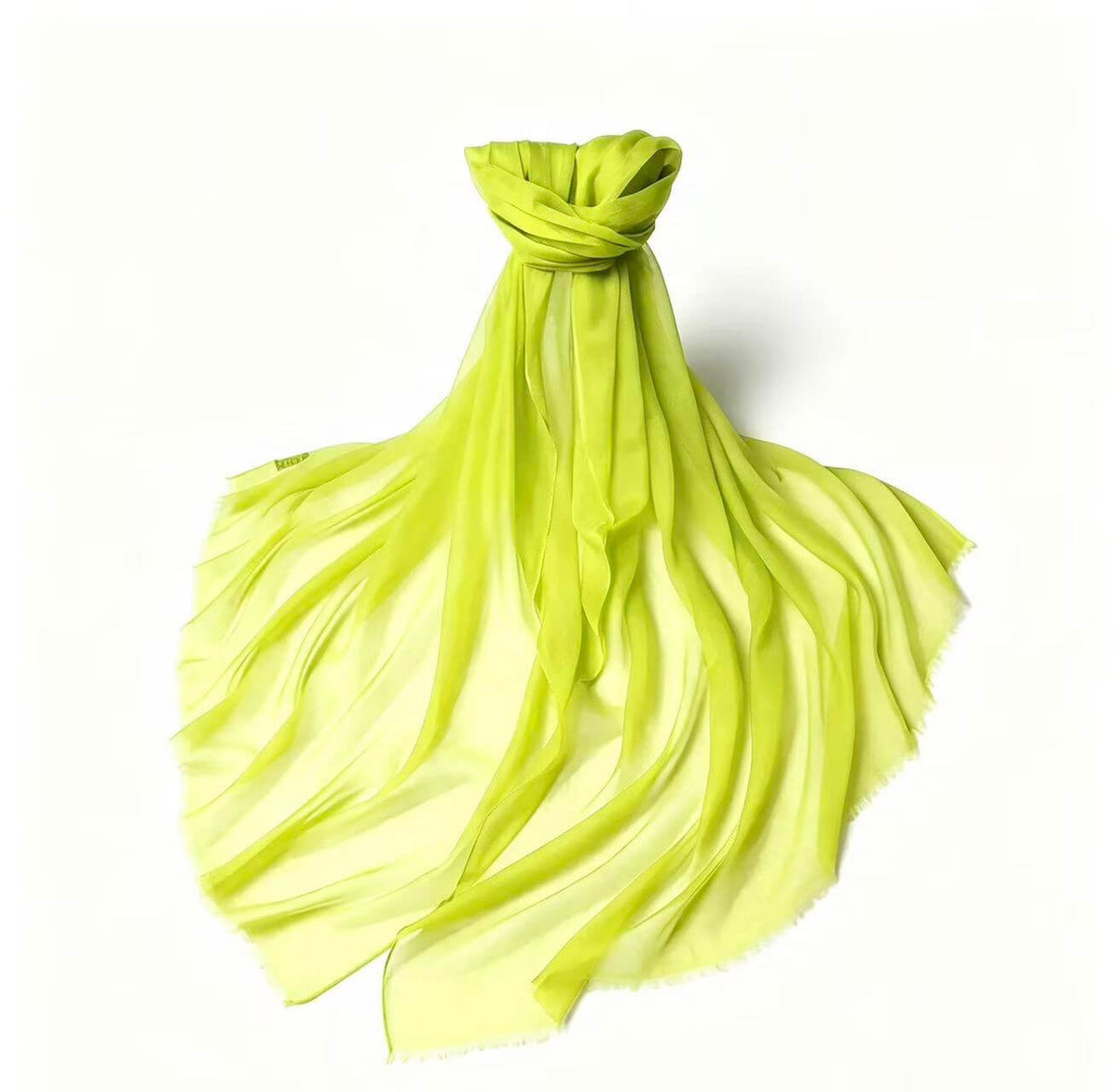 Women's featherweight 100% cashmere wrap in vibrant lime green with subtle tonal variations