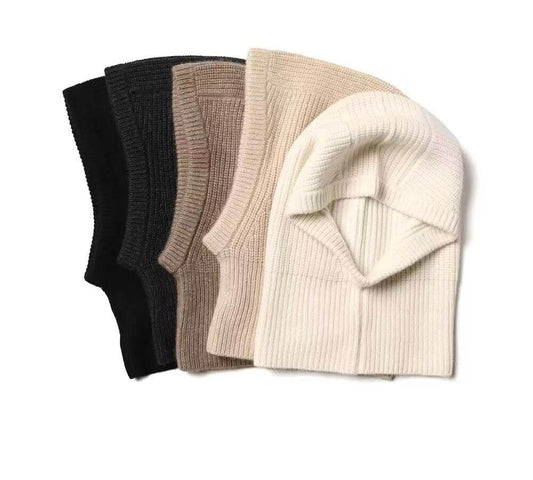 Four ribbed knit cashmere beanie hats in black, dark gray, taupe, and cream, 