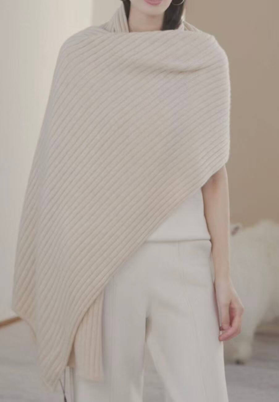 Women's luxury cashmere ribbed scarf wrapped around the neck for warmth, comfort and timeless winter style