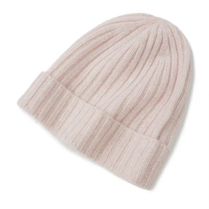 Luxury 100% cashmere ribbed beanie in blush pink, soft winter hat for women, cozy and elegant cold-weather style.