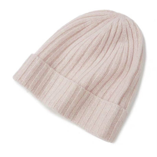 Luxury 100% cashmere ribbed beanie in blush pink, soft winter hat for women, cozy and elegant cold-weather style.
