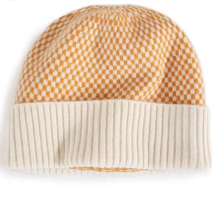 100% cashmere checkerboard beanie in white and marigold yellow