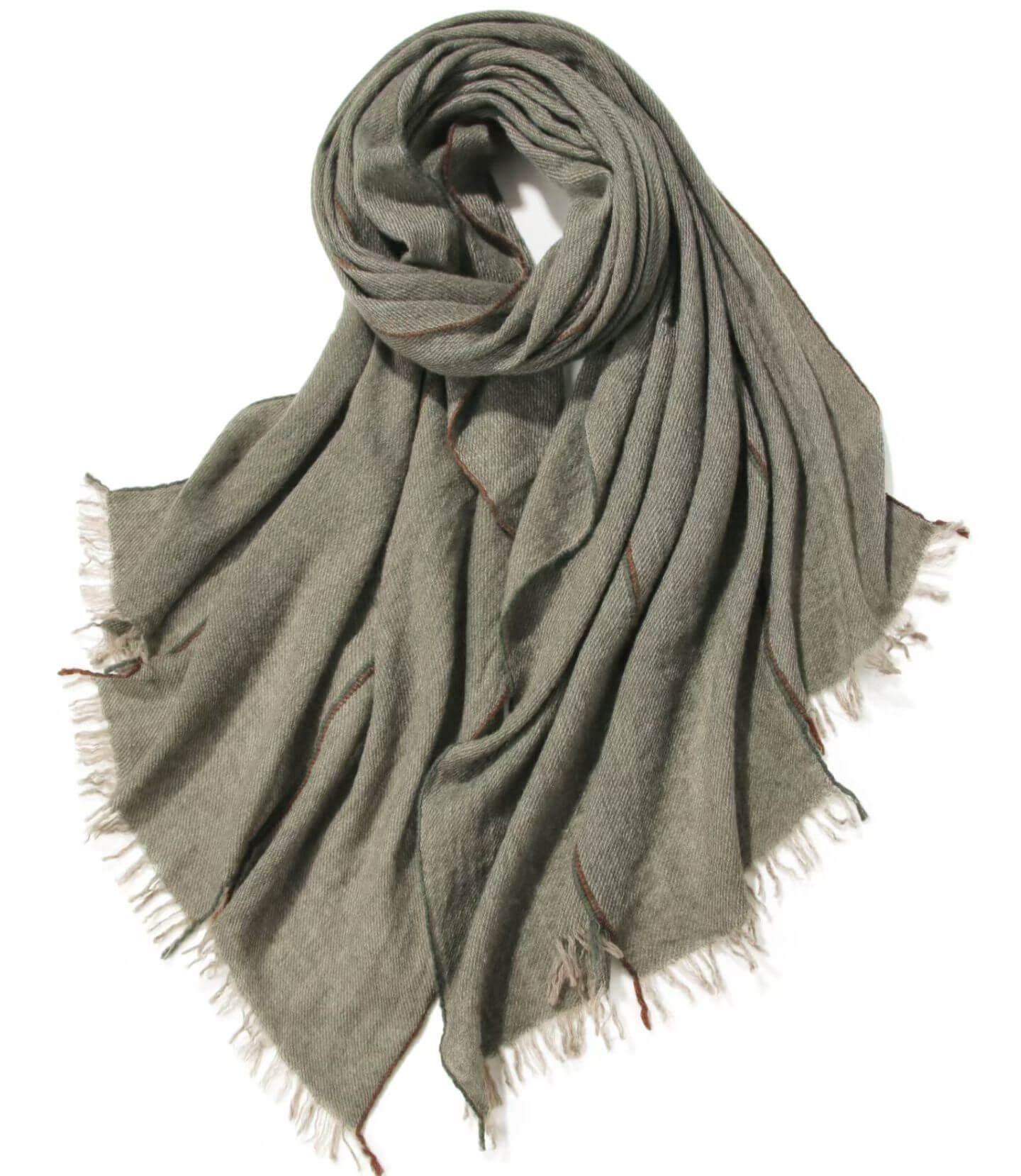 Soft cashmere wrap draped over shoulders in green color