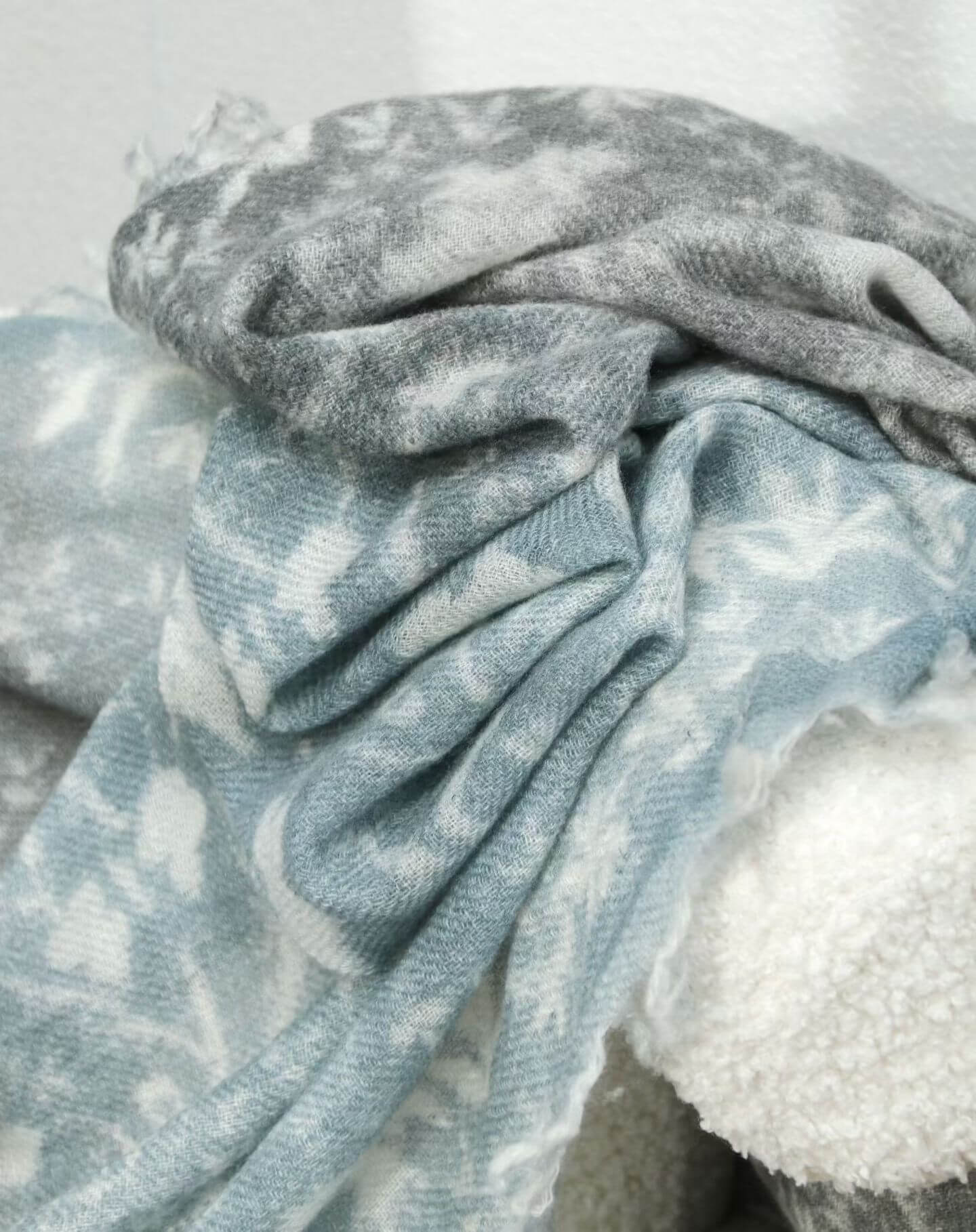 Soft Mongolian cashmere scarf draped over shoulders