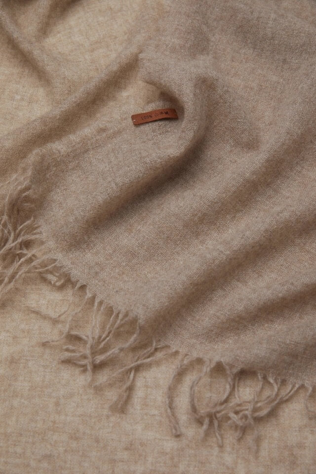 	Premium undyed cashmere shawl styled as a large winter wrap