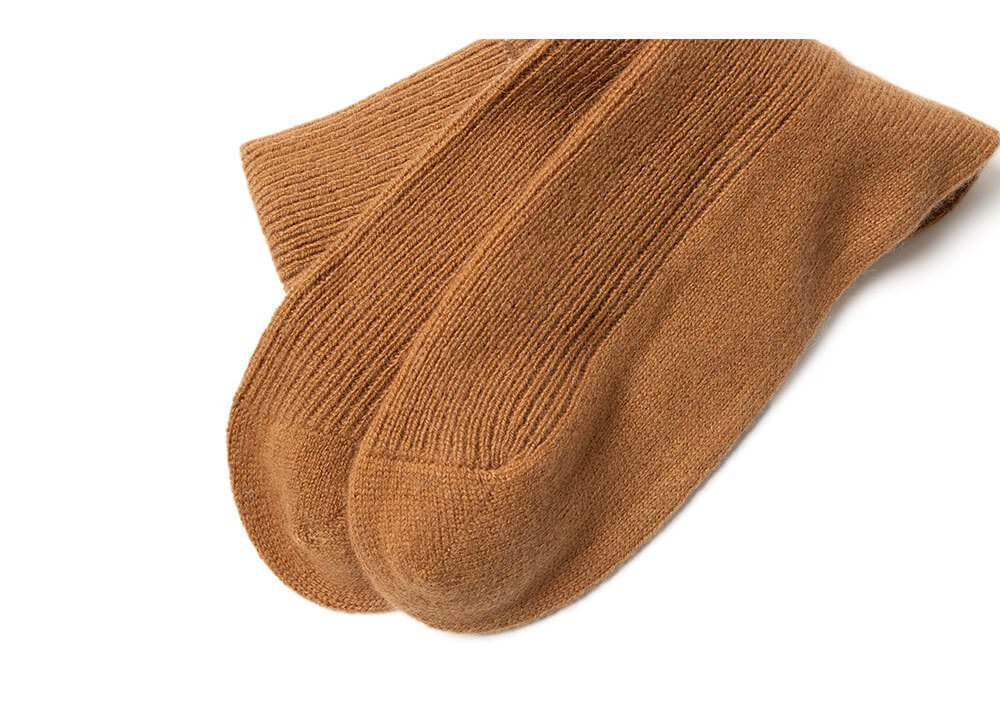Pumpkin orange cashmere socks for women, warm fall color, cozy home wear.