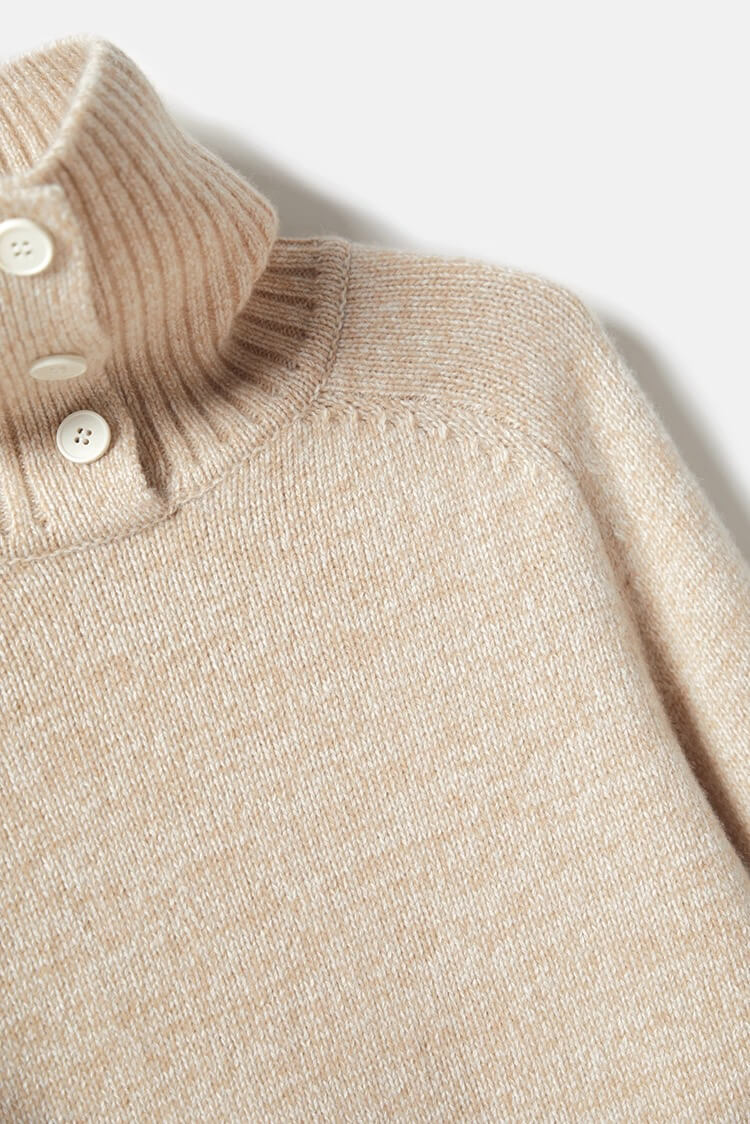 Close-up of ribbed double collar and button placket on beige cashmere sweater