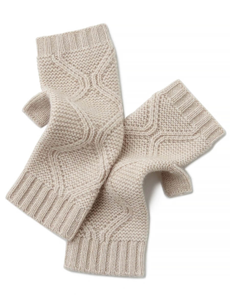 Pair of beige knitted fingerless cashmere gloves on a white background
