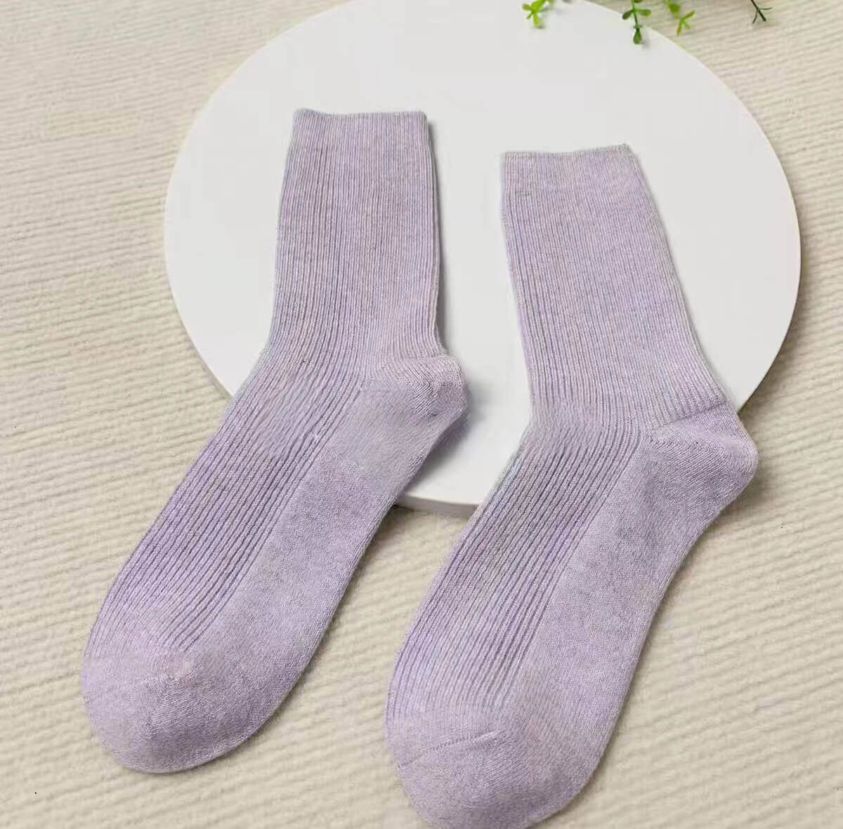 The Ribbed Cashmere Socks in purple,	Soft Cashmere Home Socks for Women on Hardwood Floor