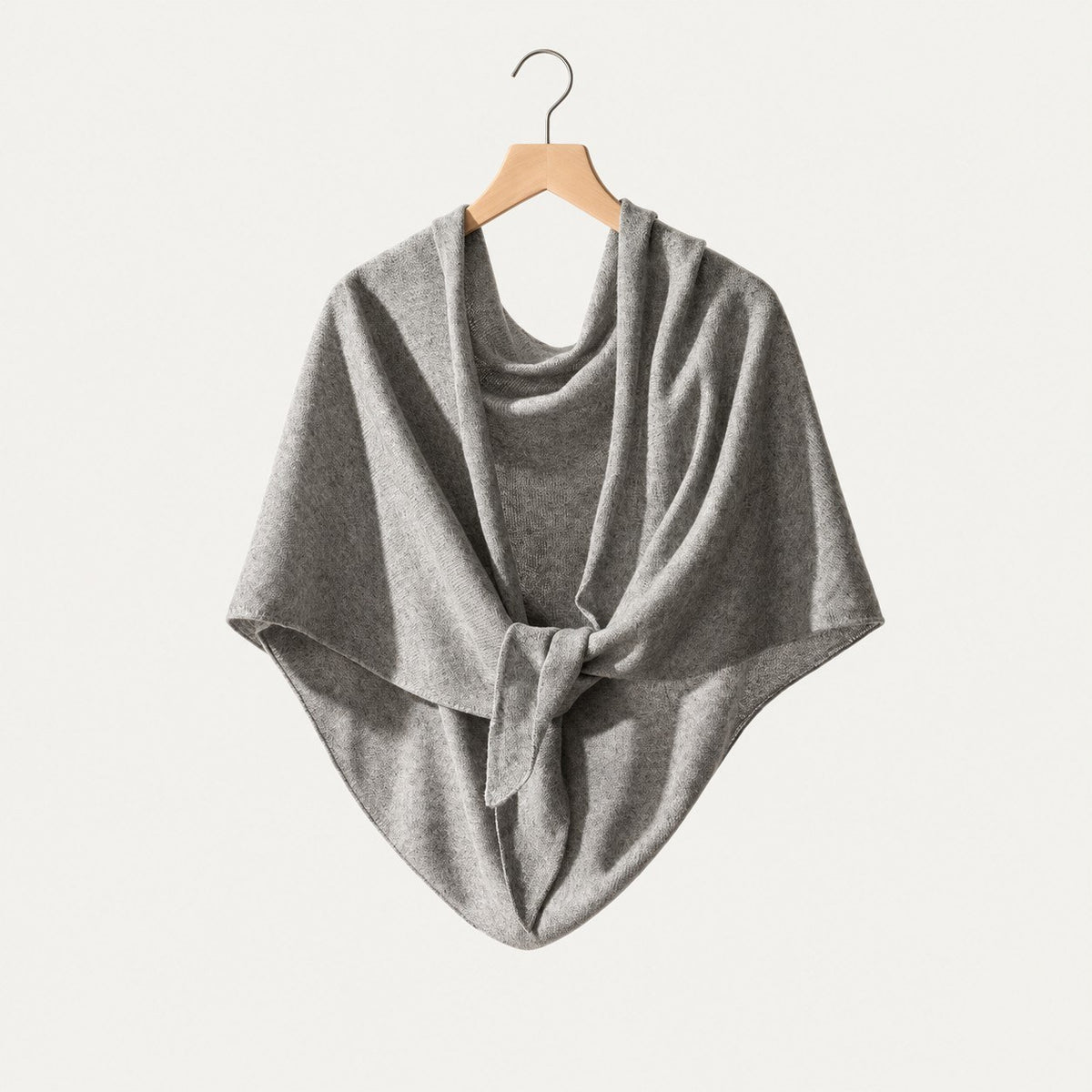 Grey lightweight 100% cashmere triangle scarf on a hanger