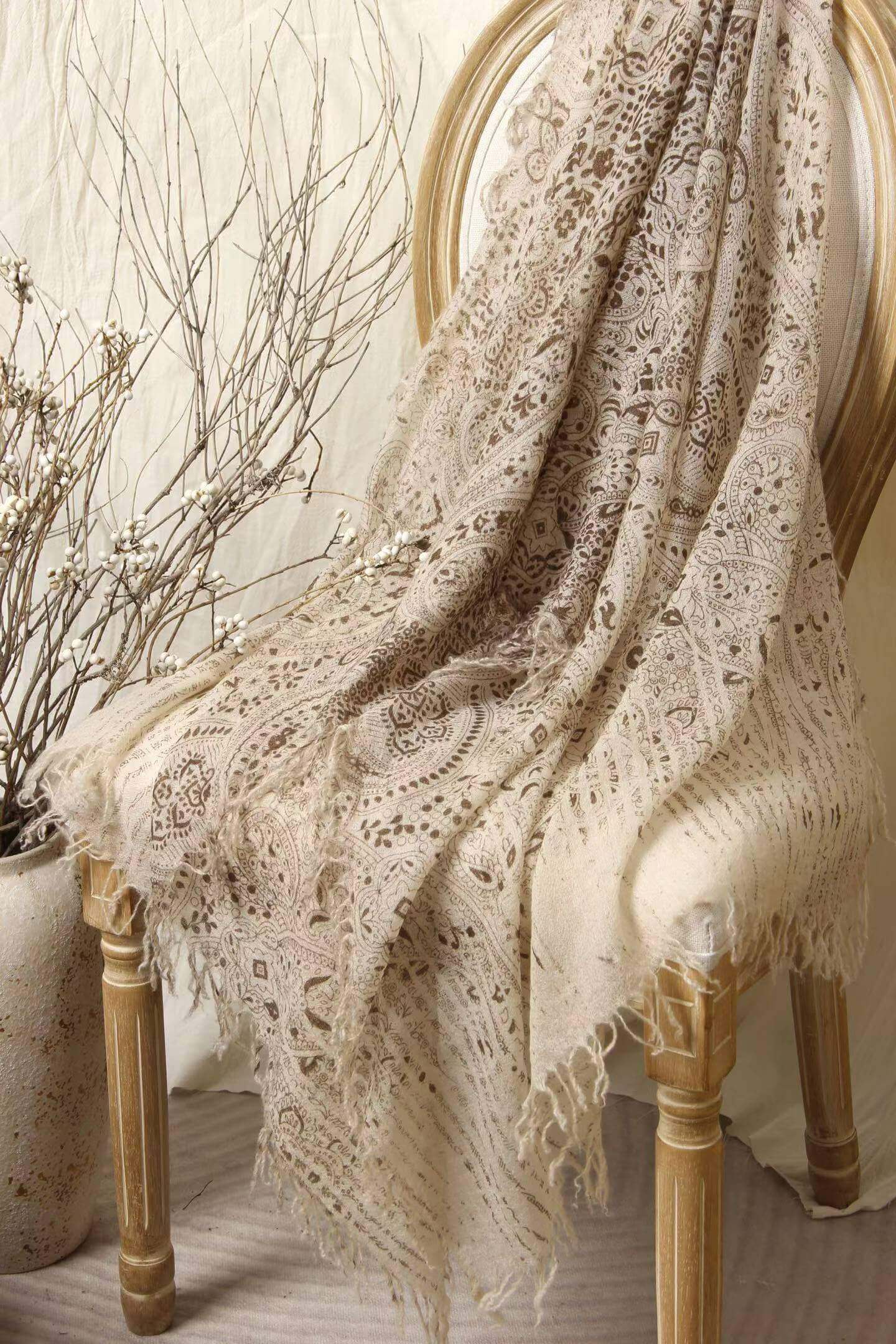 	beige paisley cashmere scarf close up fabric texture detail