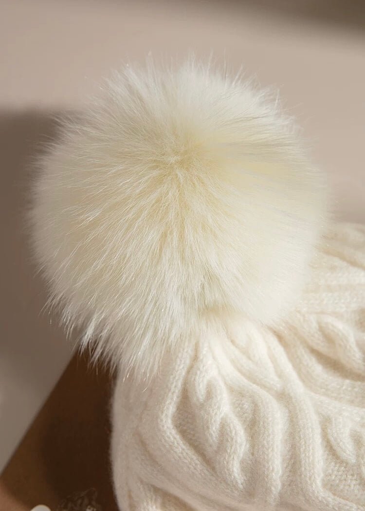 Cashmere cable knit pom pom hat in beige
Diamond and cable knit cashmere pom pom hat