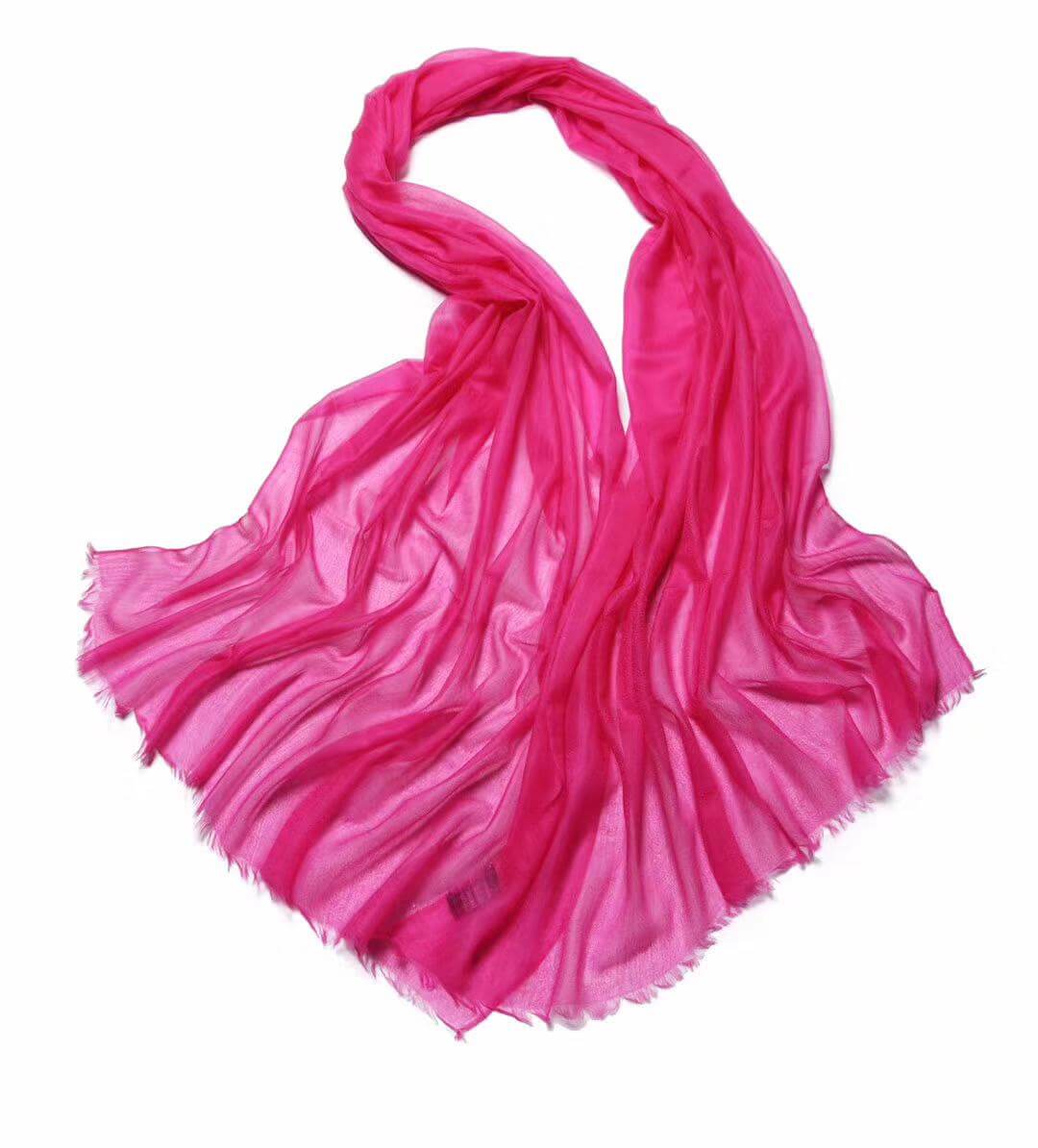Luxury meets comfort in this ultra-thin 100% cashmere wrap in hot pink. Soft, breathable, and perfect for travel, work, or special occasions. 
