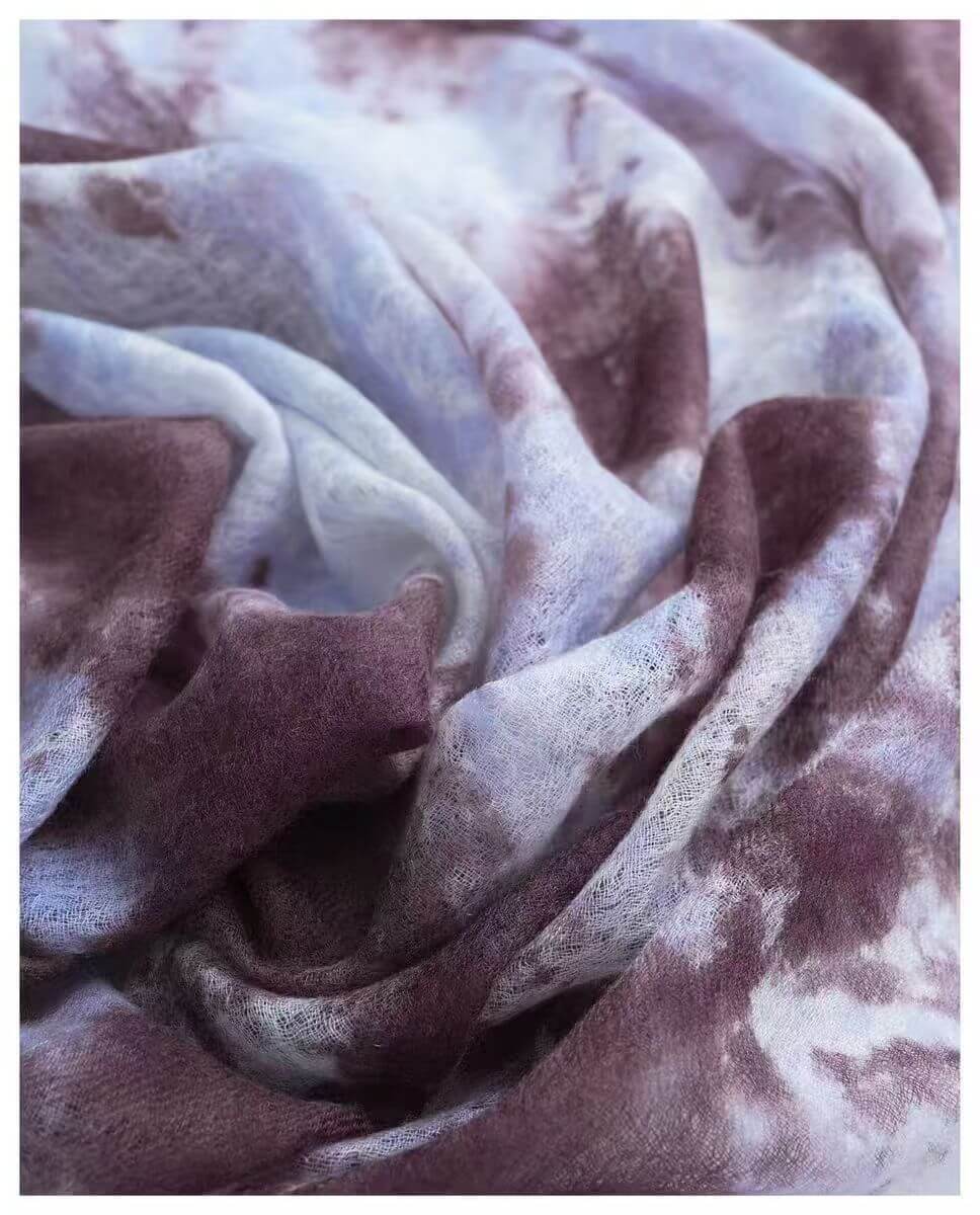oversized square cashmere scarf worn as shoulder wrap