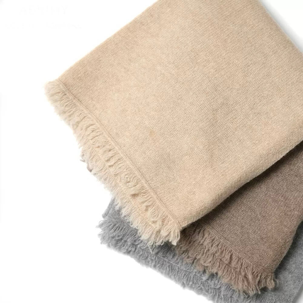 	Beige 100 percent cashmere knitted scarf in minimalist luxury winter style
